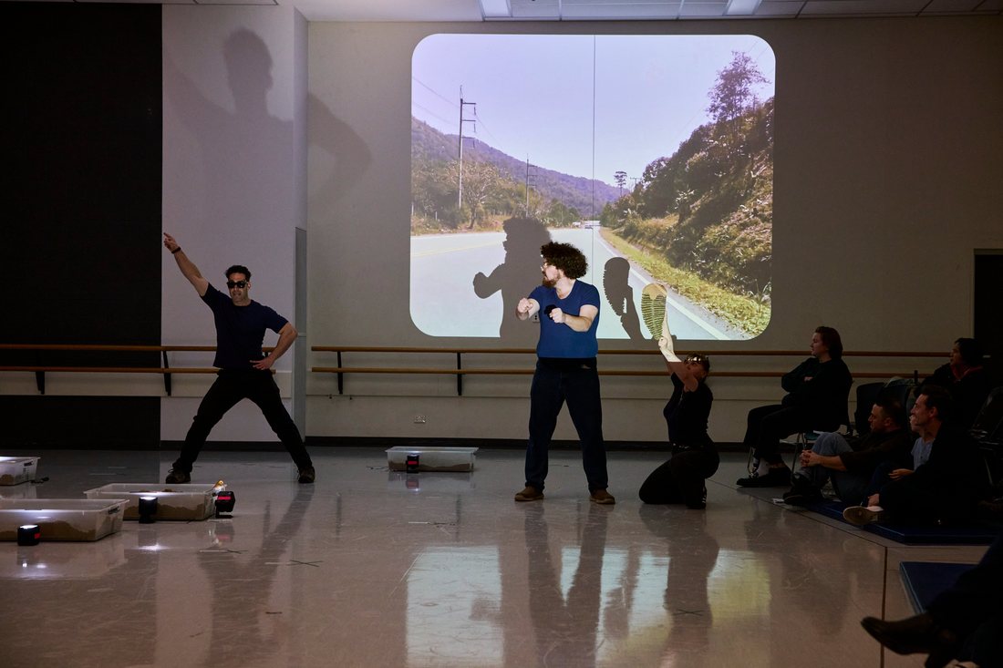 The Dig rehearsal — a scene played against projected outback roads