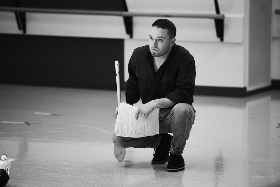The Dig rehearsal — Matt crouched with shovel and script