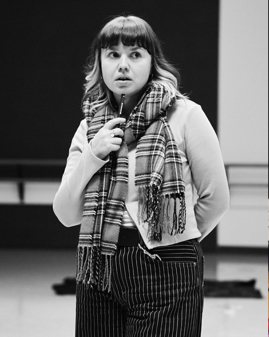 The Dig rehearsal — a searcher in scarf and stripes